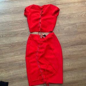 Two piece thick stretch material with opening in middle of top which is crop